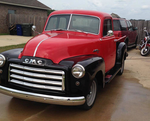 بازسازی بدنه جی‌ام‌سی با صافکاری و نقاشی کوره‌ای